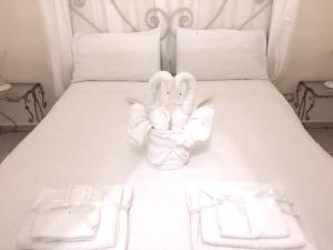 Postel nebo postele na pokoji v ubytování B&B Smeraldo