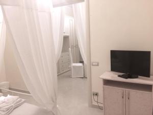 TV a/nebo společenská místnost v ubytování B&B Smeraldo