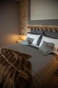 מיטה או מיטות בחדר ב-Villa & Spasuitebo Roma