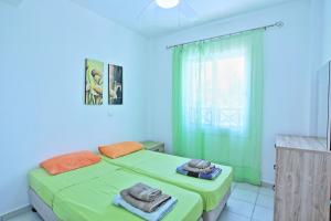 a bedroom with two beds with towels on them at Villa Irina Polis in Polis Chrysochous +35 photos