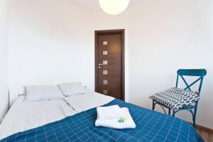 Posteľ alebo postele v izbe v ubytovaní Apartament Zaciszny