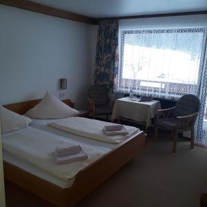 A bed or beds in a room at Pension Brix