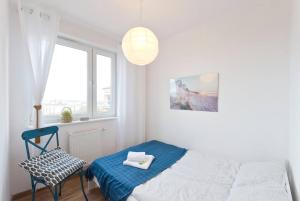 Posteľ alebo postele v izbe v ubytovaní Apartament Zaciszny