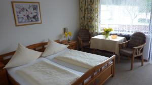 A bed or beds in a room at Pension Brix