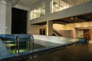 a swimming pool in the middle of a building at The Grand Asansol in Āsansol