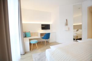 Rúm í herbergi á Boutique Hotel Reschen
