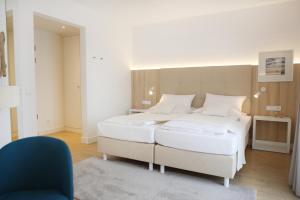 Rúm í herbergi á Boutique Hotel Reschen