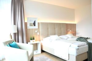 Rúm í herbergi á Boutique Hotel Reschen