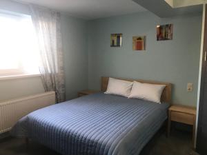 Postel nebo postele na pokoji v ubytování Dudman Hotel