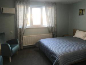 Postel nebo postele na pokoji v ubytování Dudman Hotel