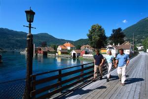 a group of people walking on a bridge over a river at Lodge Visnes Stryn in Stryn