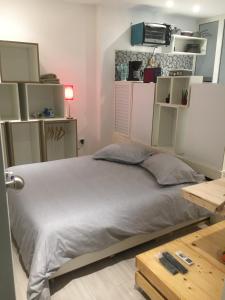 Ένα ή περισσότερα κρεβάτια σε δωμάτιο στο Le cocon de Sfax