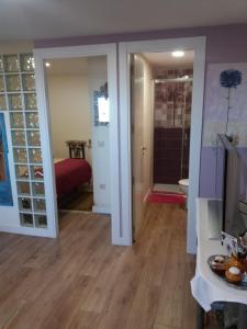 a living room with a sliding glass door leading to a bedroom at El Balcón de la Mata in Mata de Quintanar