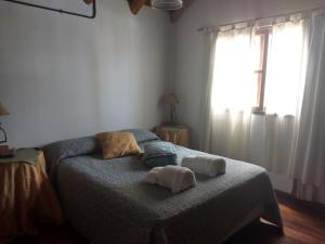 Cama ou camas em um quarto em Cabañas del Uru