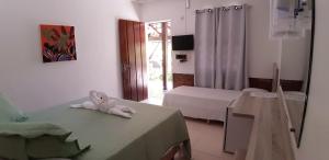 Postel nebo postele na pokoji v ubytování Atobá Villas