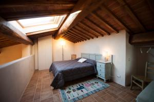 A bed or beds in a room at San Giovanni In Poggio