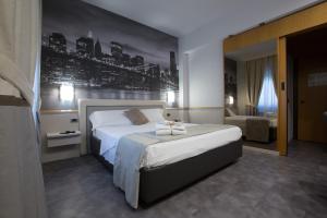Postel nebo postele na pokoji v ubytování Hotel City Legnano