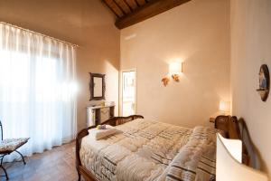 A bed or beds in a room at San Giovanni In Poggio