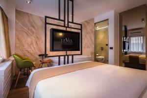 Postel nebo postele na pokoji v ubytování Level Luxury Suites