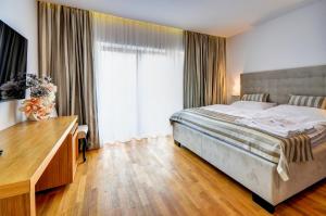 Postel nebo postele na pokoji v ubytování hotel Chmelnice