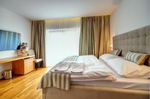 Postel nebo postele na pokoji v ubytování hotel Chmelnice