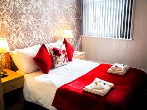 Un pat sau paturi într-o cameră la Carlton House Scarborough