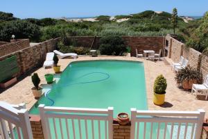 The swimming pool at or close to Bluewater Beachfront Guest House
