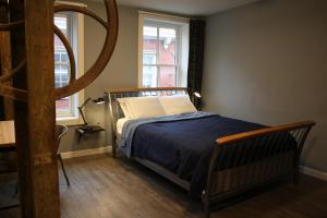 Säng eller sängar i ett rum på Apple Hostels of Philadelphia