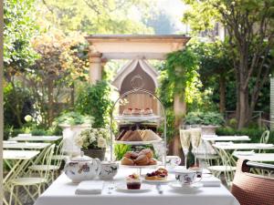 a table with a plate of food on top of it at Number Sixteen, Firmdale Hotels in London