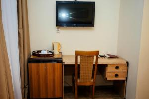 Televízia a/alebo spoločenská miestnosť v ubytovaní Апартаменты Sampo