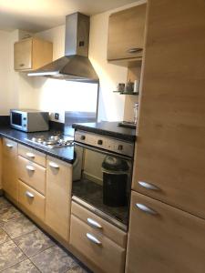 a kitchen with a stove top oven in a kitchen at South Shore Road, Gateshead in Gateshead