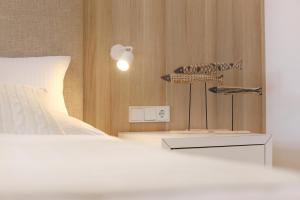 Rúm í herbergi á Boutique Hotel Reschen