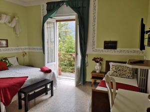 Säng eller sängar i ett rum på Hotel La Congiura dei Baroni