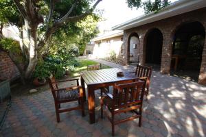 A patio or other outdoor area at Bluewater Beachfront Guest House