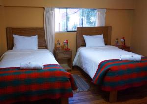 Llit o llits en una habitació de Eco Aventura Hostel Cusco