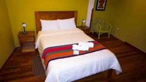 Llit o llits en una habitació de Eco Aventura Hostel Cusco