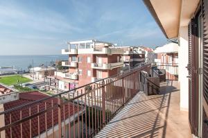 an apartment balcony with a view of the ocean at Sunset Home Sperlonga - Allogio per uso turistico Giulia Sabella in Sperlonga
