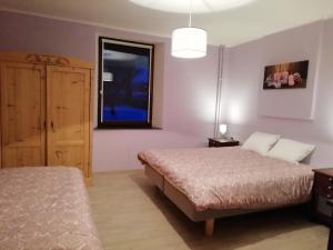 Postel nebo postele na pokoji v ubytování Au bord de l'Eau