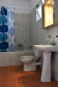 A bathroom at Raph's Studios-Apts By The Sea
