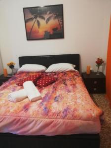 a bedroom with a bed with two towels on it at Venice Best Vacation in Marghera