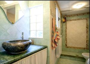 a bathroom with a large bowl sink on a counter at Taverna rustica in Toscana in Fucecchio