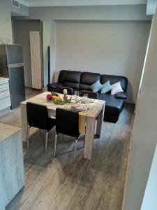 a living room with a table and a couch at BGY Central Apartments in Bergamo