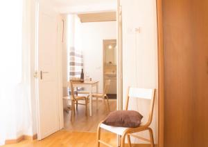 a room with a mirror and a table and chairs at Dolce Vita Old Town Studio in Dubrovnik +22 photos