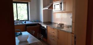 
A kitchen or kitchenette at Albufeira, Corcovada 35
