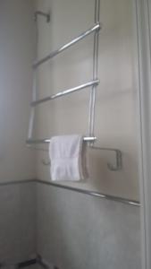 a bathroom with a towel hanging on a towel rack at Dominique's Getaway NYC in Bronx