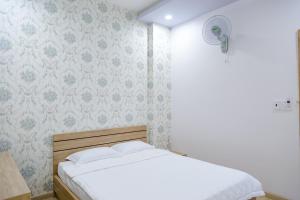 Un ou plusieurs lits dans un hébergement de l'établissement Nam Anh Hotel