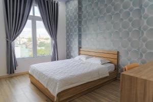Кровать или кровати в номере Nam Anh Hotel