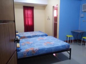 Letto o letti in una camera di Mayon Lodging House