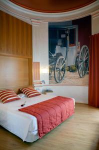 A bed or beds in a room at Itaca Jerez by Soho Boutique