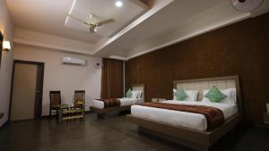 Postel nebo postele na pokoji v ubytování Kukda Resort Chittorgarh